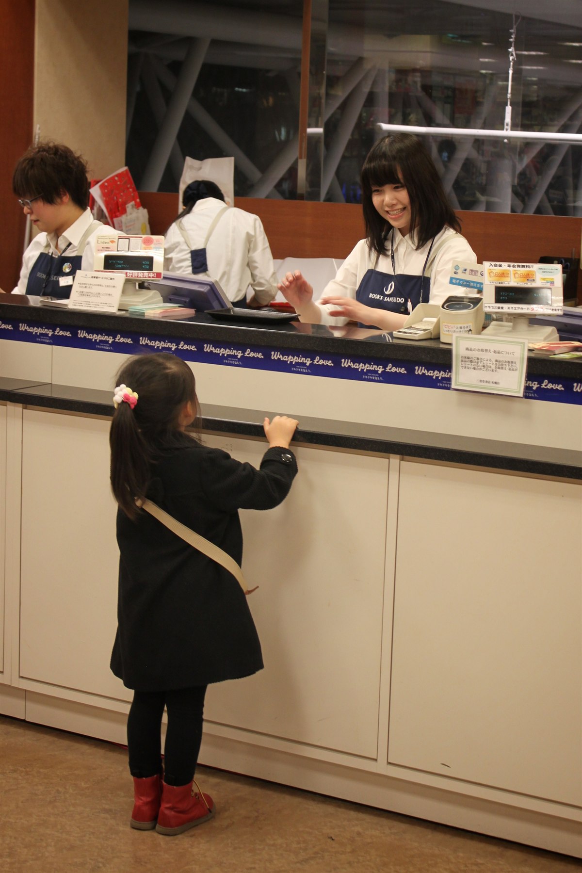 Fast book billing counter with cashier scanning book barcode and printing dual-tax invoice