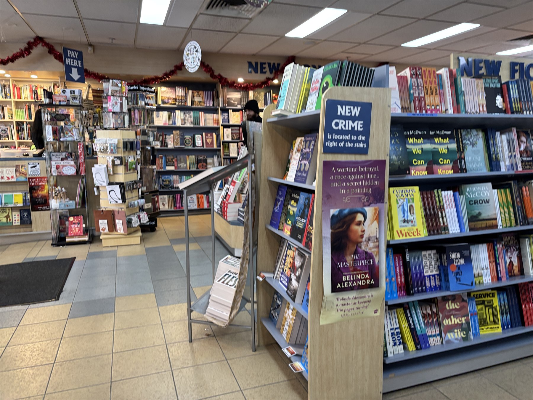 Organized tables of books and academic kits ready for student pickup in contemporary bookstore