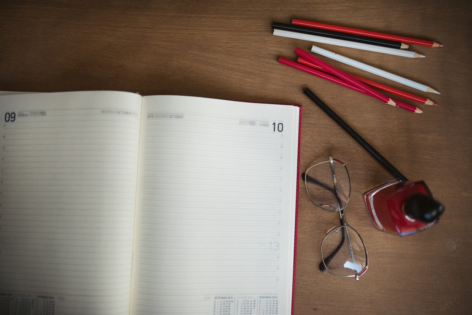 Colorful stationery items, notebooks, and artist pencils arranged neatly for student study and exam preparation